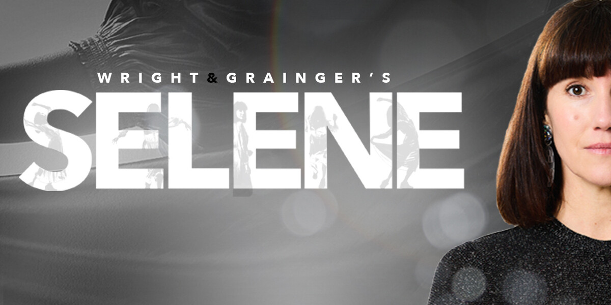 A person with mid to long dark hair a bright eyes, and sparkly top looking directly into camera.