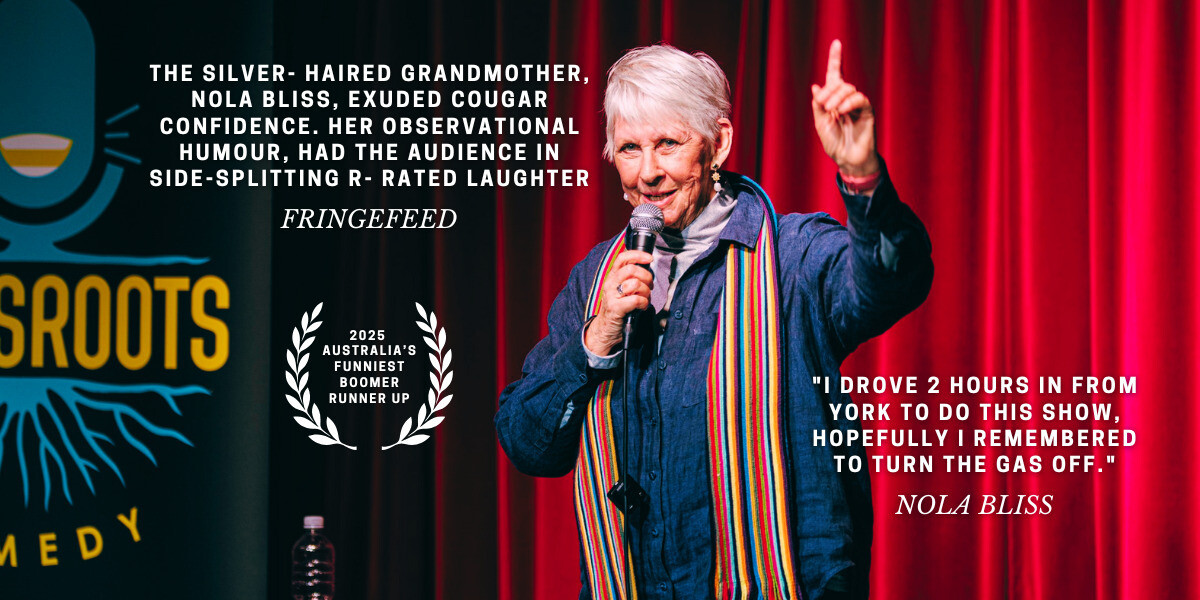 Comedian Nola Bliss performs on stage in front of red curtains, holding a microphone and raising one hand. A Grassroots Comedy banner is partially visible on the left. Text on the image reads: “The silver-haired grandmother, Nola Bliss, exuded cougar confidence. Her observational humour had the audience in side-splitting R-rated laughter – FringeFeed.” Below is a laurel badge labelled “2025 Australia’s Funniest Boomer Runner Up.” On the right, additional text reads: “I drove 2 hours in from York to do this show, hopefully I remembered to turn the gas off. – Nola Bliss.”