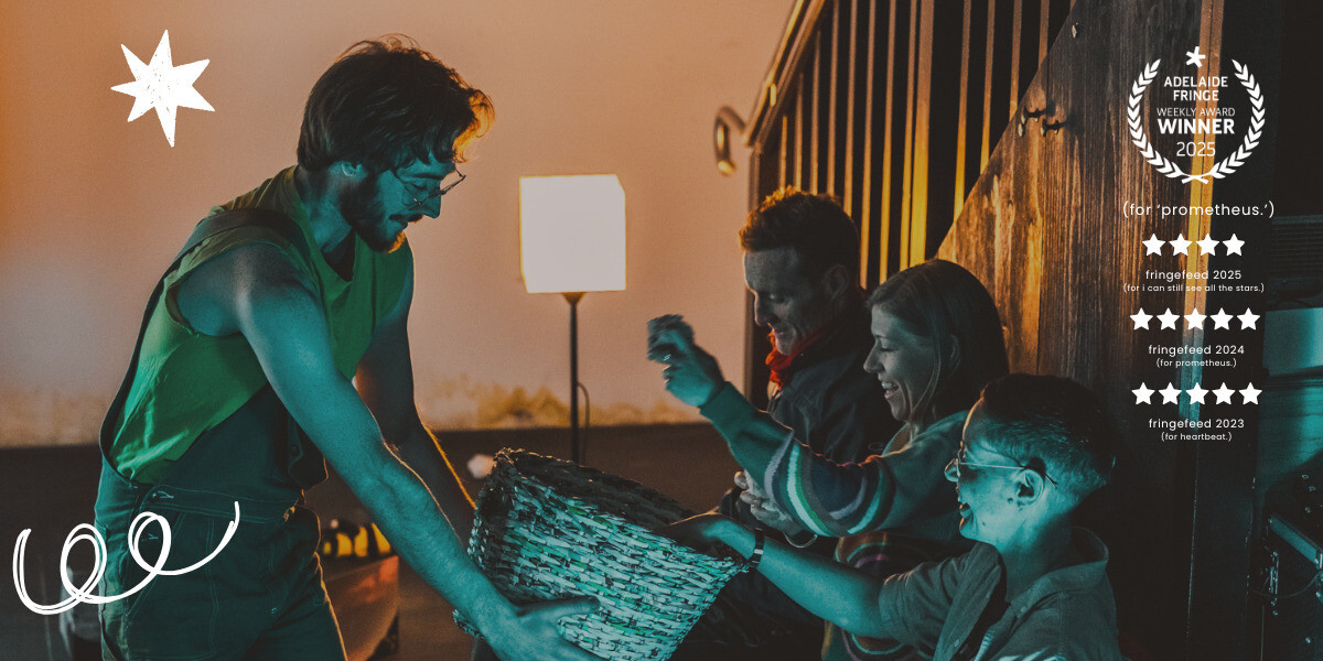 a person with scruffy ginger hair, a yellow shirt and brown dungarees holds a basket towards three audience members, who are laughing and reaching inside. over the right side of the image is a list of accolades from previous shows: a weekly award laurel from adelaide fringe, two five star reviews and one four star review from fringefeed.
